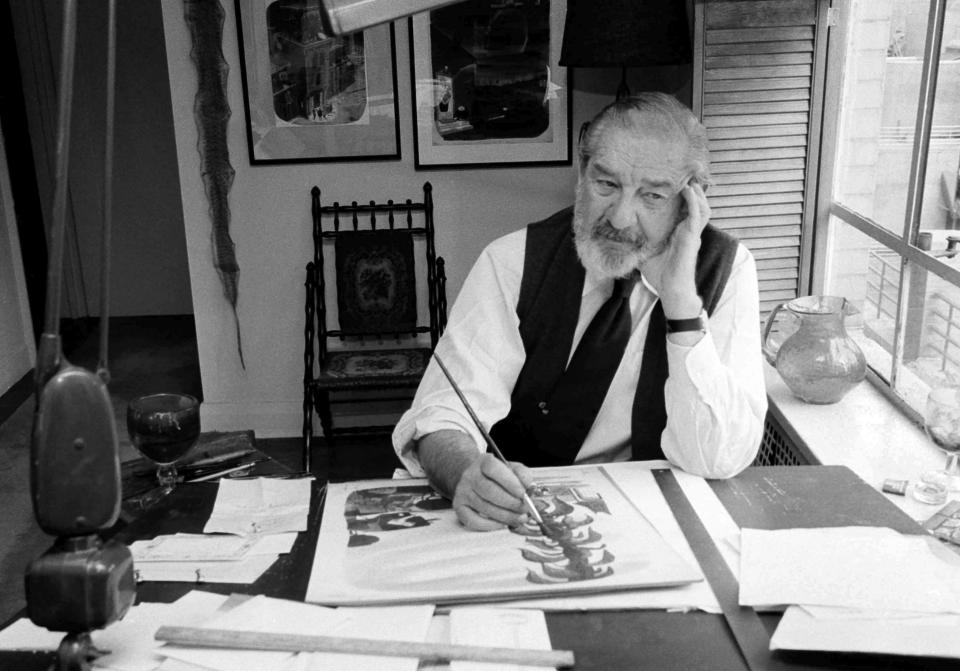 This 1978 file photo shows Charles Addams, cartoonist and collector of pre-historic items, at the drawing board in New York. An exhibition on his work and career is coming to Cheekwood in Nashville on Oct. 8.