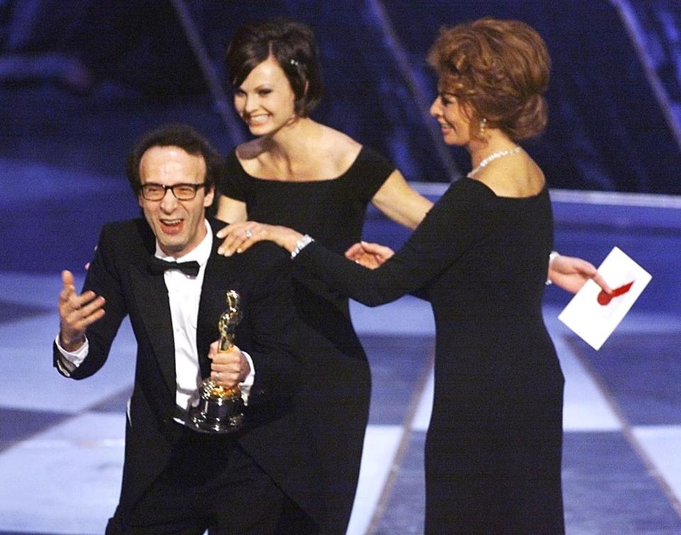 1999: Roberto Benigni leaps onto chairs and up to the stage