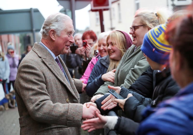 FILE PHOTO: Britain's Prince Charles visits the town of Pontypridd affected by recent floods in Wales