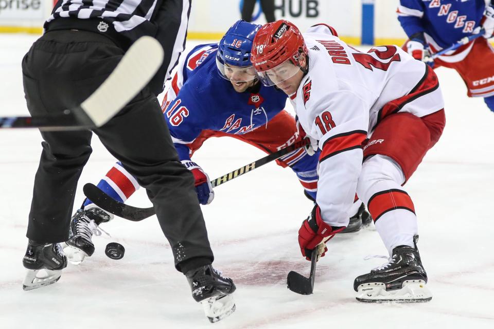 Nov 2, 2023; New York, New York, USA; New York Rangers center Vincent Trocheck (16) and Carolina Hurricanes center Jack Drury (18) battle for a face off in the second period at Madison Square Garden. Mandatory Credit: Wendell Cruz-USA TODAY Sports