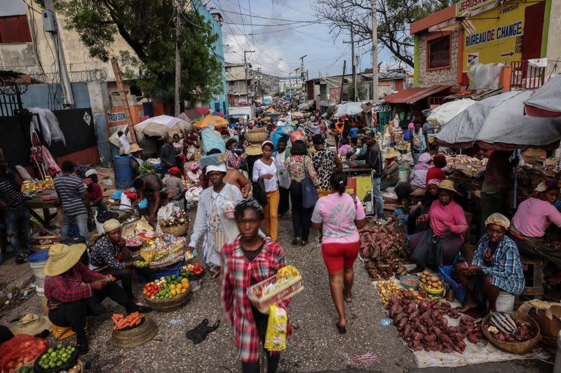 The Wider Image: Camping in schools, hungry Haiti families ask: when will normality return?