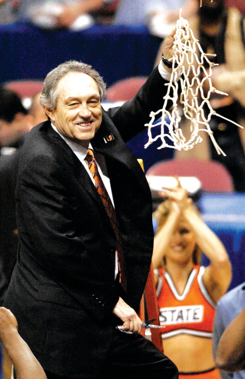 Eddie Sutton finished cutting the net after coaching OSU to the 2004 Final Four with a win over Saint Joseph's in East Rutherford, N.J.