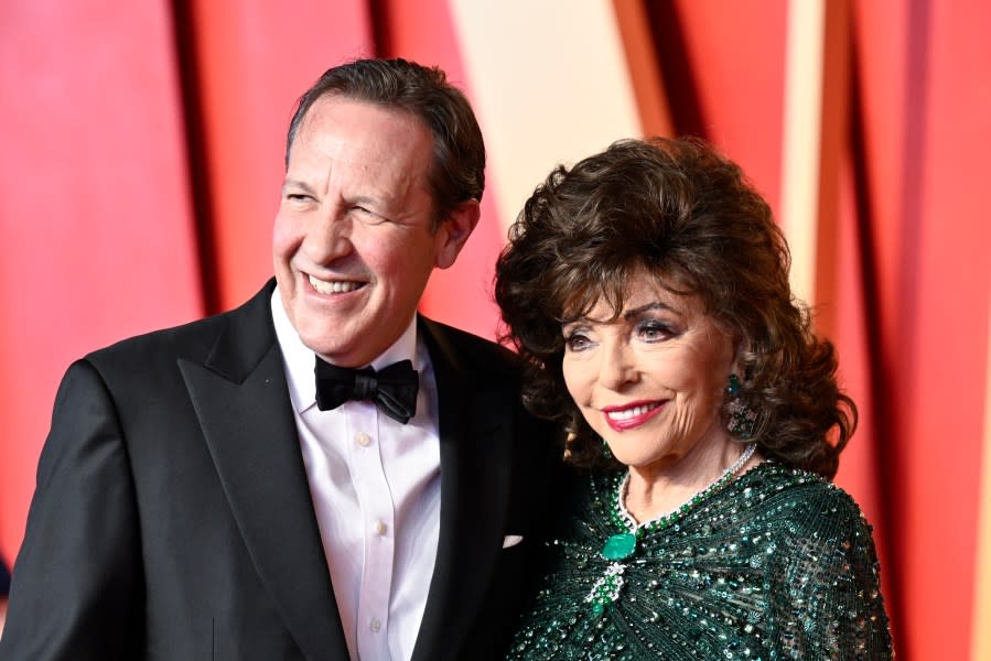 Percy Gibson, left, and Joan Collins arrive at the Vanity Fair Oscar Party on Sunday, March 10, 2024, at the Wallis Annenberg Center for the Performing Arts in Beverly Hills, Calif. (Photo by Evan Agostini/Invision/AP)