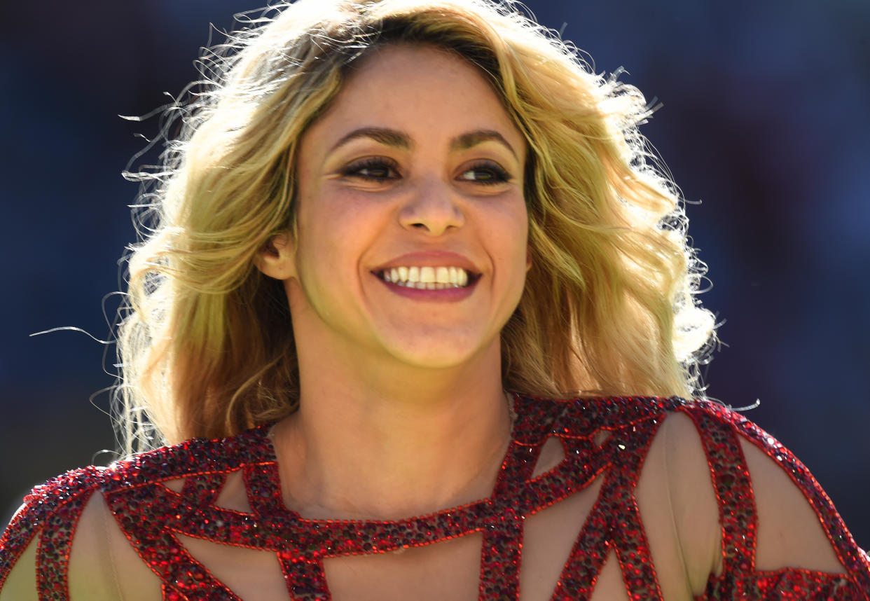 Colombian singer Shakira performs during the Closing Ceremony before the FIFA World Cup 2014 final soccer match between Germany and Argentina at the Estadio do Maracana in Rio de Janeiro, Brazil, 13 July 2014. Photo: Marcus Brandt/dpa (RESTRICTIONS APPLY: Editorial Use Only, not used in association with any commercial entity - Images must not be used in any form of alert service or push service of any kind including via mobile alert services, downloads to mobile devices or MMS messaging - Images must appear as still images and must not emulate match action video footage - No alteration is made to, and no text or image is superimposed over, any published image which: (a) intentionally obscures or removes a sponsor identification image; or (b) adds or overlays the commercial identification of any third party which is not officially associated with the FIFA World Cup) EDITORIAL USE ONLY | usage worldwide   (Photo by Marcus Brandt/picture alliance via Getty Images)