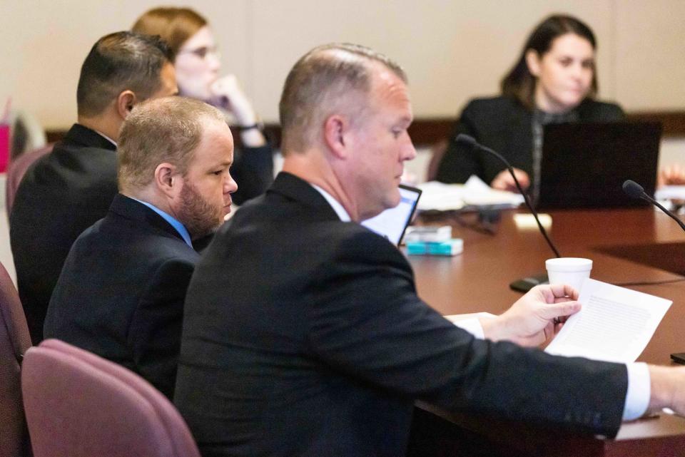 Michael Wayne Jones, with beard, and his lawyers.