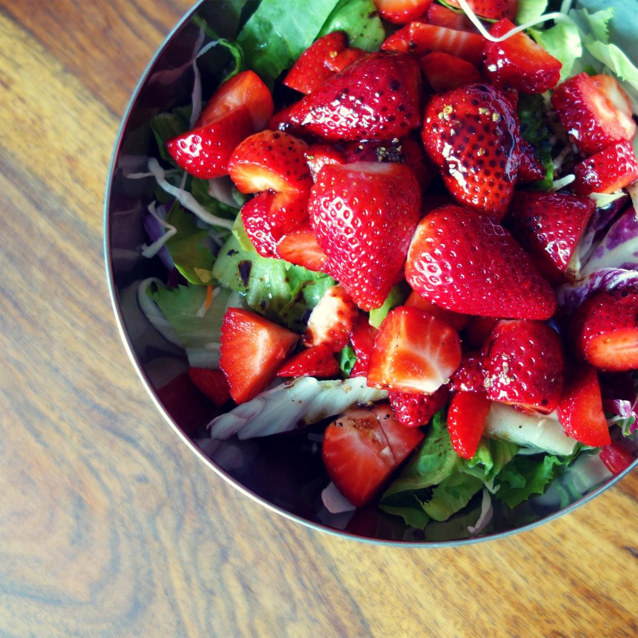 Strawberries with balsamic and greens