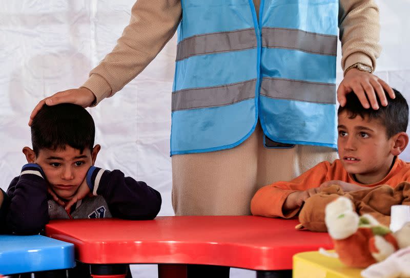 FILE PHOTO: Children attend an activity to entertain and support the mental health of children affected by the deadly earthquake, at a camp for survivors, in Adiyaman