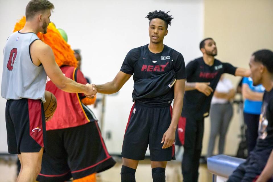 Heat center Meyers Leonard (0) shakes hands with rookie forward KZ Okpala (4) during the fourth day of Heat training camp at the Countess de Hoernle Student Life Center at Keiser University in West Palm Beach on Oct. 4, 2019.