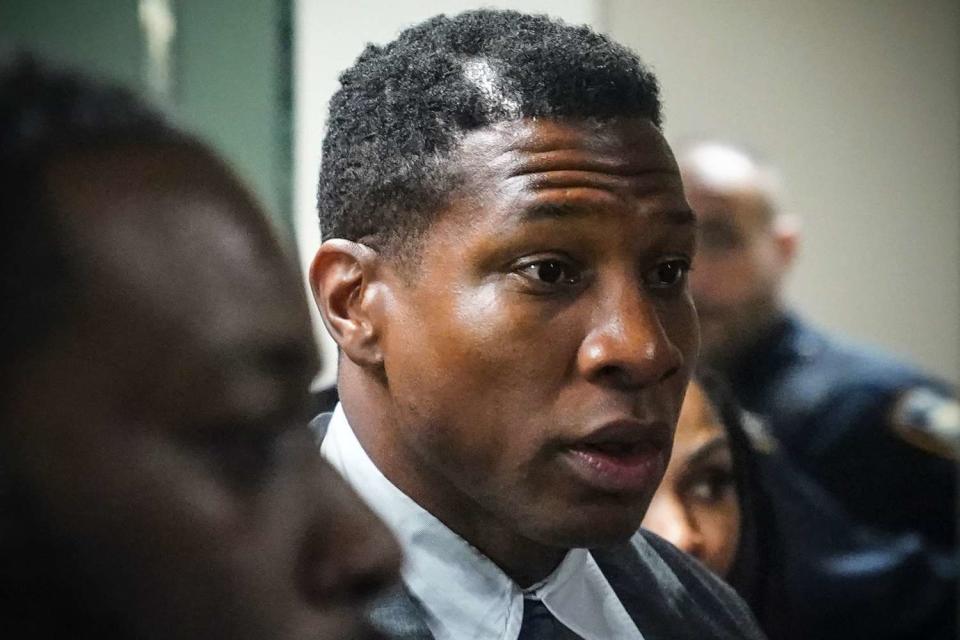 <p>Bebeto Matthews/AP Photo</p> Jonathan Majors, left, returns to court after a lunch break in his domestic assault trial, Tuesday, Dec. 5, 2023, in New York