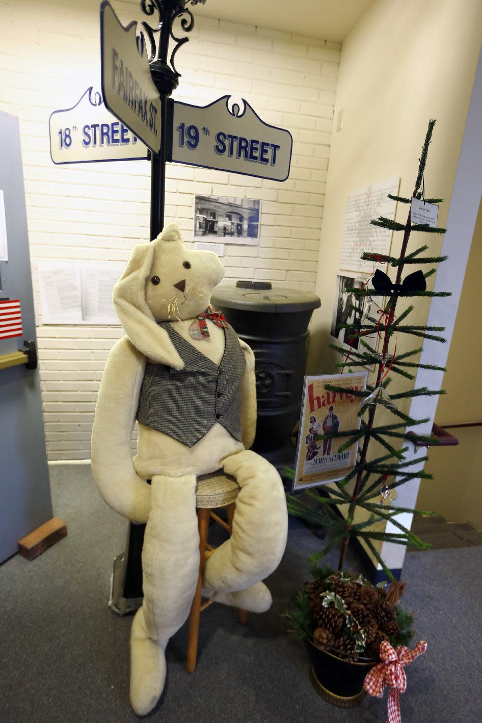 In this photo made on Friday, Dec. 20, 2013, a large stuffed rabbit , representing the imaginary character from the movie "Harvey" is on a stool outside the entrance to at the Jimmy Stewart Museum in Indiana, Pa. The museum dedicated to the life of the star of many films including the holiday favorite "It's A Wonderful Life" is located in the off-the-beaten track town where Stewart grew up. The museum still attracts visitors from all over the country. It’s full of displays not just about Hollywood, but about Stewart’s service as a bomber pilot in World War II, his well-to-do ancestors, and his family life. (AP Photo/Keith Srakocic)