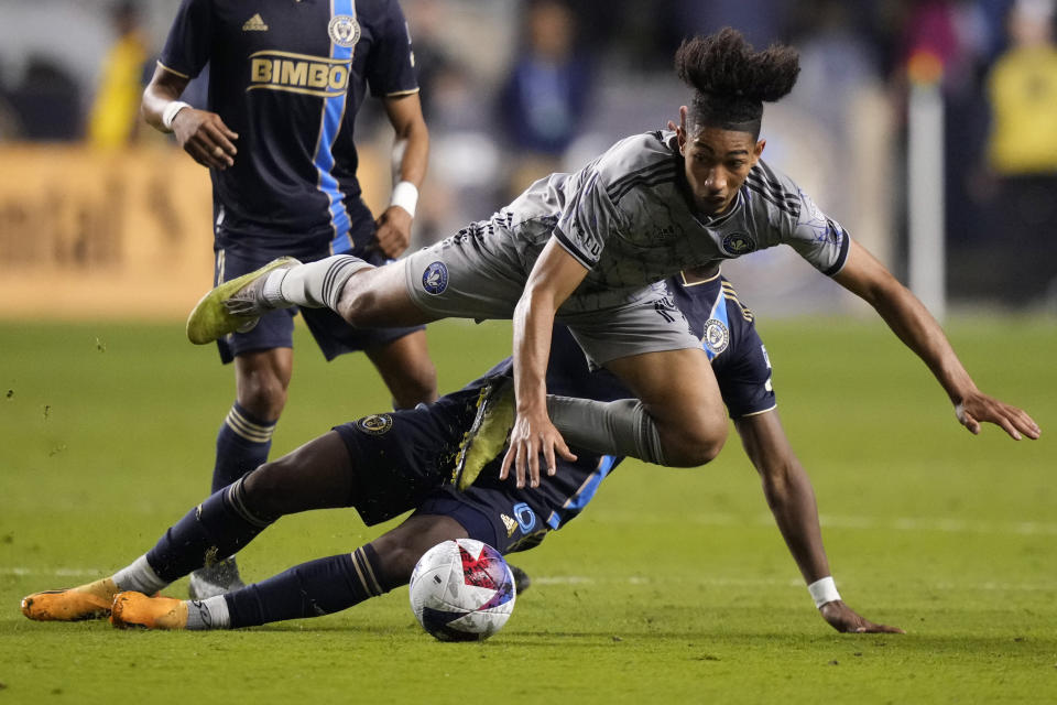 CF Montréal's Nathan-Dylan Saliba, top, collides with Philadelphia Union's Andrés Perea during the second half of an MLS soccer match, Saturday, June 3, 2023, in Chester, Pa. (AP Photo/Matt Slocum)