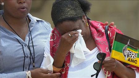 A woman reacts at the Union Buildings in Pretoria where former South African President Nelson Mandela is lying in state in this still image taken from December 12, 2013 video courtesy of the South Africa Broadcasting Corporation (SABC). REUTERS/SABC via Reuters TV