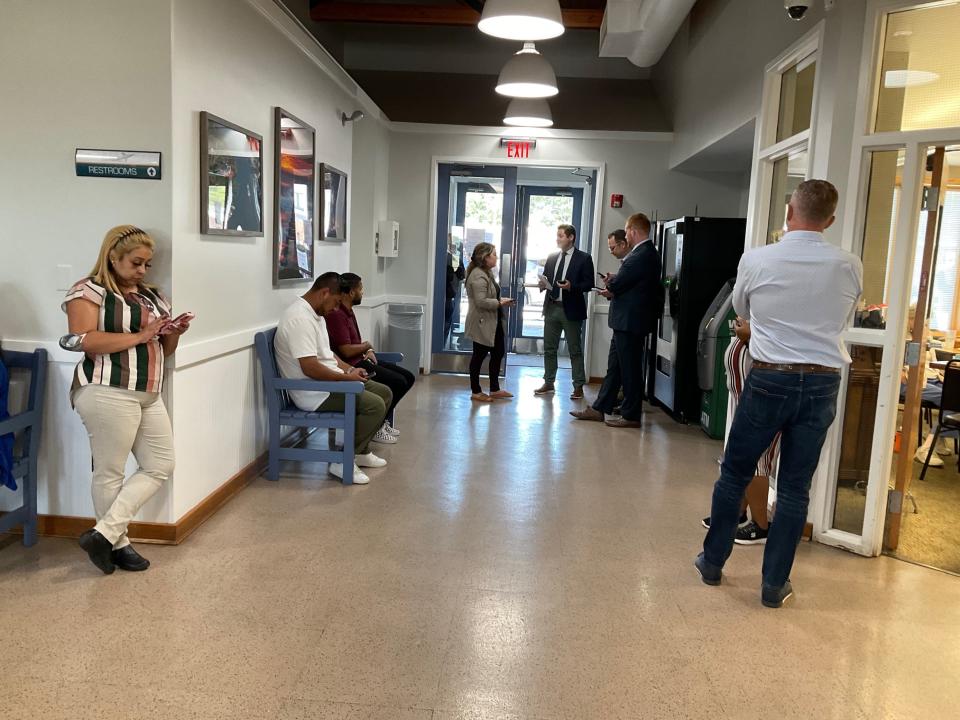 People wait inside Delaware Coastal Airport in Georgetown on Tuesday, Sept. 20, 2022.