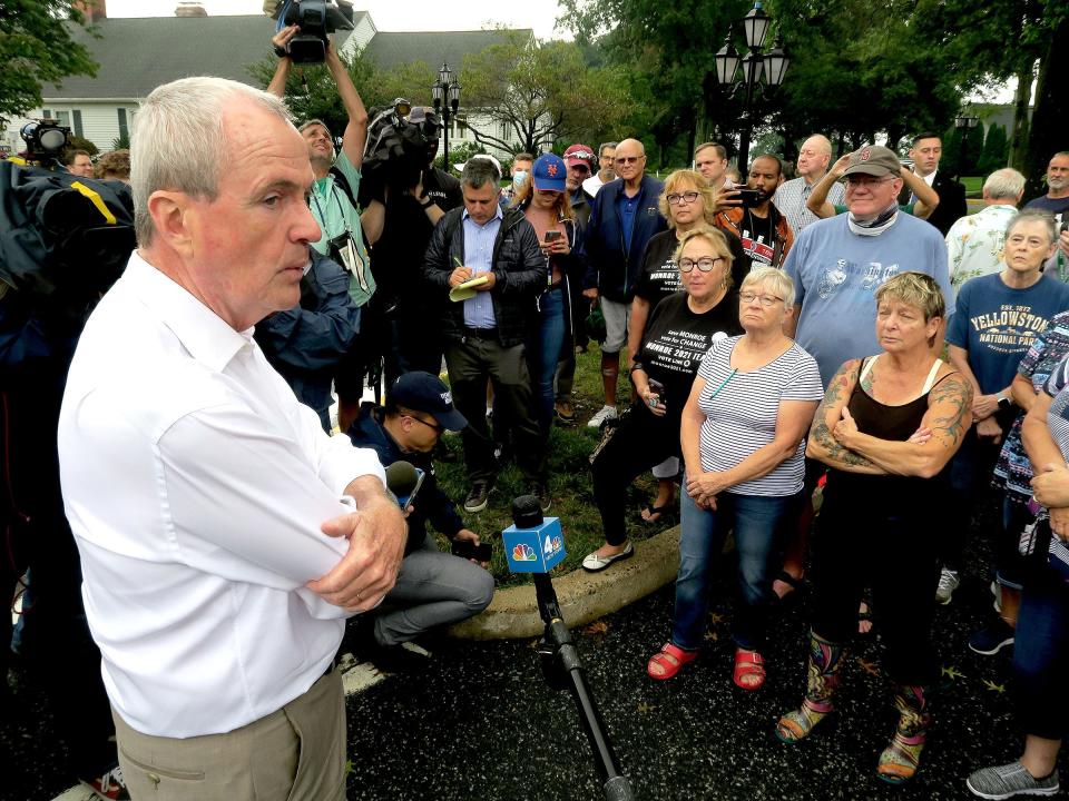 NJ Governor Phil Murphy speaks Monday morning, August 23, 2021, with residents from the Rossmoor community in Monroe Township who had their homes damaged by flooding over the weekend.