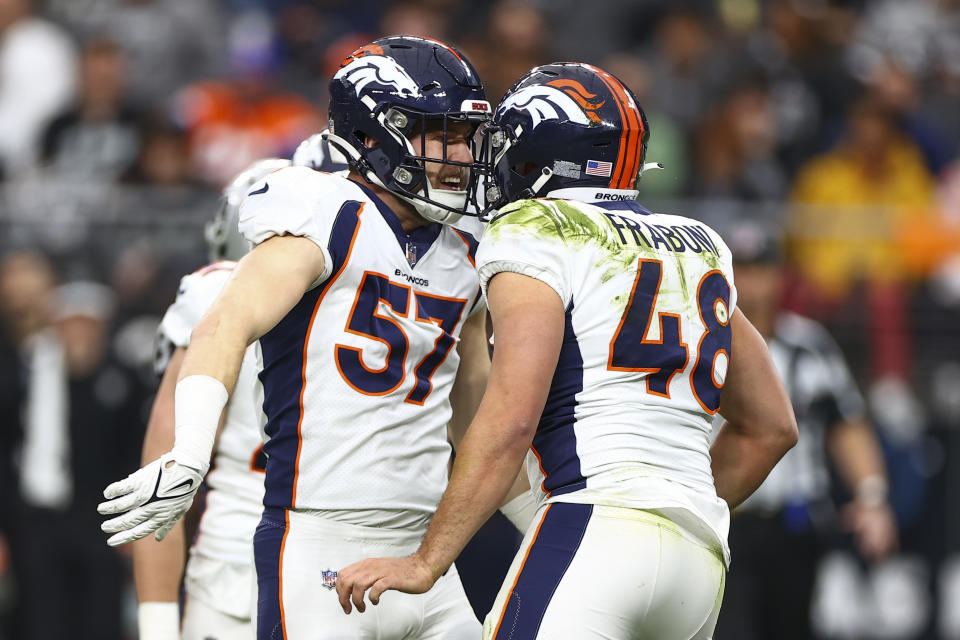 Denver Broncos linebacker Ben Niemann (57) celebrates a hit by Mitchell Fraboni (48) during the first half of an NFL football game against the Las Vegas Raiders, Sunday, Jan. 7, 2024 in Las Vegas. (AP Photo/Ellen Schmidt)