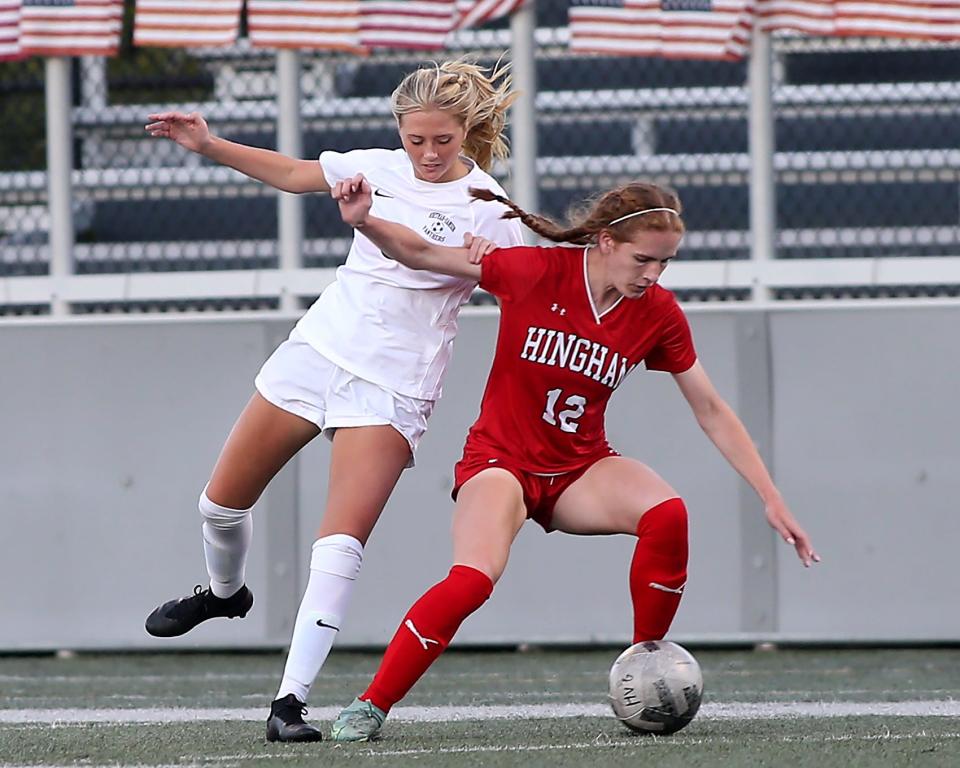 Hingham's Claire Murray looks to hold off Whitman-Hanson's Ella Eagle during first half action of their game against Whitman-Hanson at Hingham High on Tuesday, Sept. 27, 2022. 