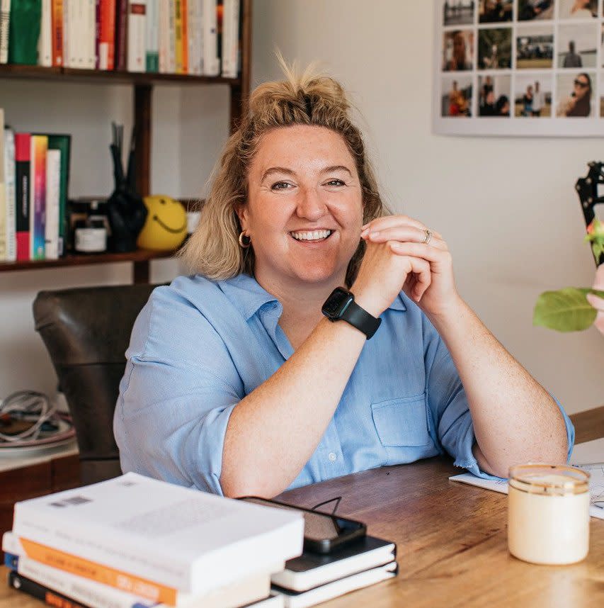 Amanda Perry in her office surrounded by books