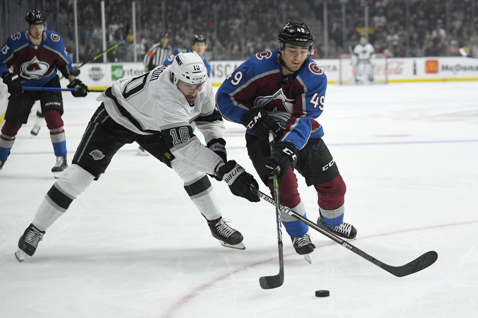 Los Angeles Kings center Michael Amadio, left, and Colorado Avalanche defenseman Samuel Girard vie for the puck during the second period of an NHL hockey game Saturday, Feb. 22, 2020, in Los Angeles. (AP Photo/Mark J. Terrill)