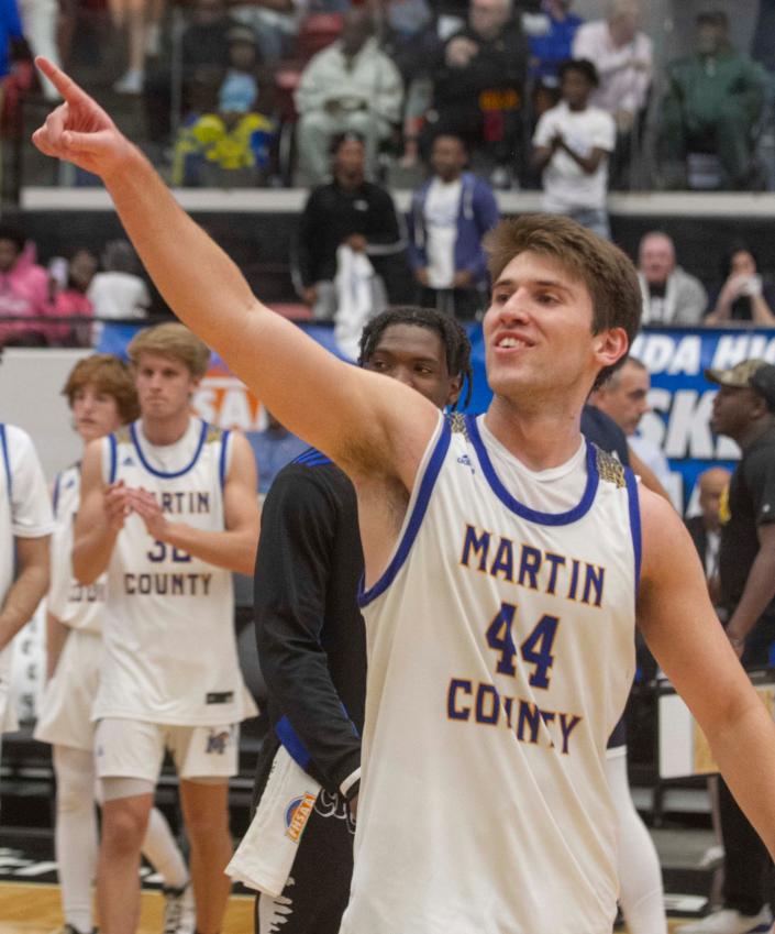 Martin County High School&#39;s Ryan Davis (44) gestures to students and fans in the stands after their win over Wharton in the FHSAA Boys 6A semifinal game at The RP Funding Center in Lakeland Thursday night. March 3, 2022. MICHAEL WILSON | LEDGER CORRESPONDENT