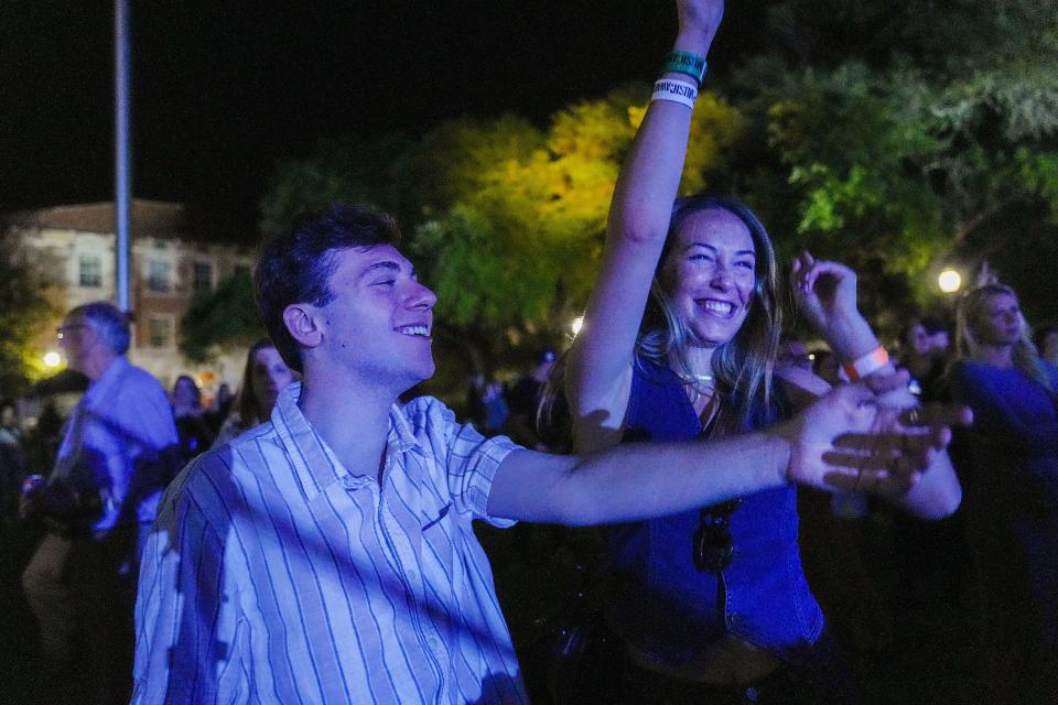 Logan Dubel and Coco Kennedy, sophomores at UT, enjoy Jordan Davis and NEEDTOBREATHE's performance at the UT Tower on April 5, 2024.