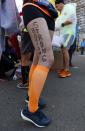 Kimberley Garcia of Boston poses with the slogan "Boston Strong" on her leg in Boston before boarding a bus to the starting line in Hopkinton, Mass., to compete in the 118th Boston Marathon Monday, April 21, 2014. (AP Photo/Matt Rourke)