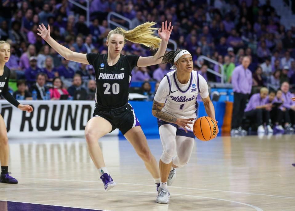 Kansas State guard Zyanna Walker (1) dribbles up court against Portland's Lainey Spear (20) during their NCAA Tournament game Friday at Bramlage Coliseum.