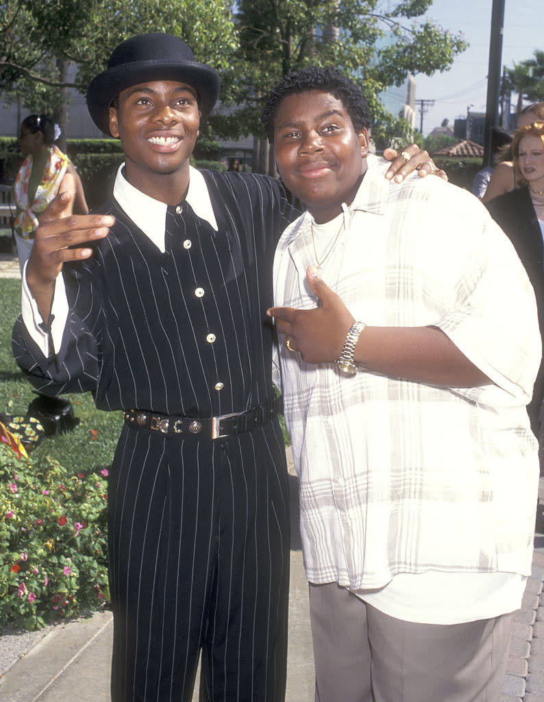 Kel in a hat and striped pant set and Kenan in a loose shirt