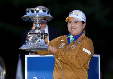 Aug 17, 2014; Pittsford, NY, USA; Inbee Park holds the trophy for winning Wegman's LPGA Championship tournament at Monroe Golf Club. Mark Konezny-USA TODAY Sports