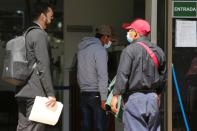 Members of Guatemalan Maya families, who feared their relatives were among 19 bodies found shot and burnt at the weekend in a remote part of northern Mexico, arrive at the Faculty of Medicine for DNA samples to help in the identification, in Guatemala City