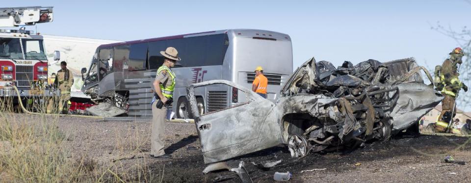 A wrong-way pickup truck driver was killed on Interstate 10 Tuesday, Nov. 20, 2012 when the vehicle collided head-on with a tour bus, forcing the closure of all westbound lanes near Casa Grande, Ariz., authorities said. The collision also involved a semi-truck, state Department of Public Safety officials said. DPS spokesman Bart Graves reported "numerous" injuries among the 16 people aboard the bus. Among the most seriously hurt was the driver of the bus, Graves said. (AP Photo/The Arizona Republic, Mark Henle)