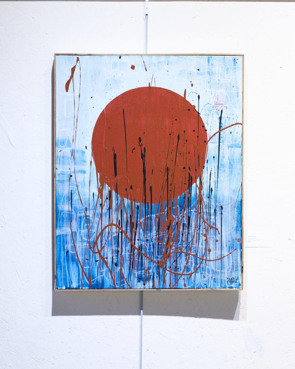 A painting by Martin Pope hangs in the Orr Street Studios gallery during a January 2024 exhibit.