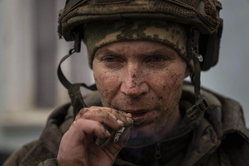 A Ukrainian serviceman aka Iva smokes a cigaret as he just come back from tranches of Bakhmut in Chasiv Yar, Ukraine, Wednesday, March 8, 2023. (AP Photo/Evgeniy Maloletka)