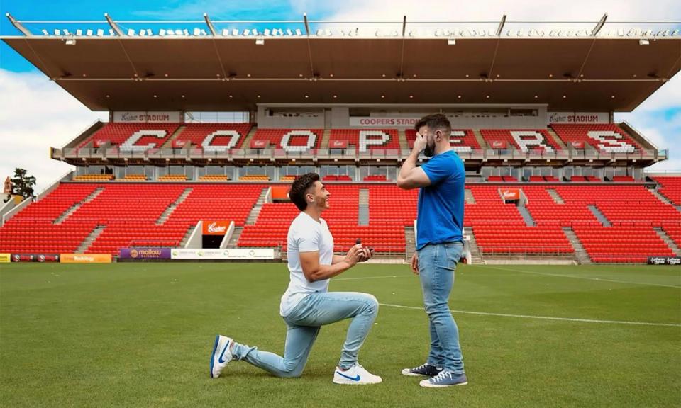 <span>Adelaide United footballer Josh Cavallo proposes to his partner Leighton Morrell at Coopers Stadium in Adelaide.</span><span>Photograph: Courtney Pedler/Adelaide United</span>