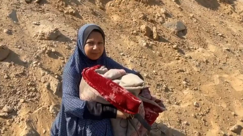 Palestinian mother Umm Ihab Arafat, shown in the Tal al-Hawa neighborhood on Friday, says she has been displaced at least four times since Israel launched its bombing campaign in Gaza. - CNN