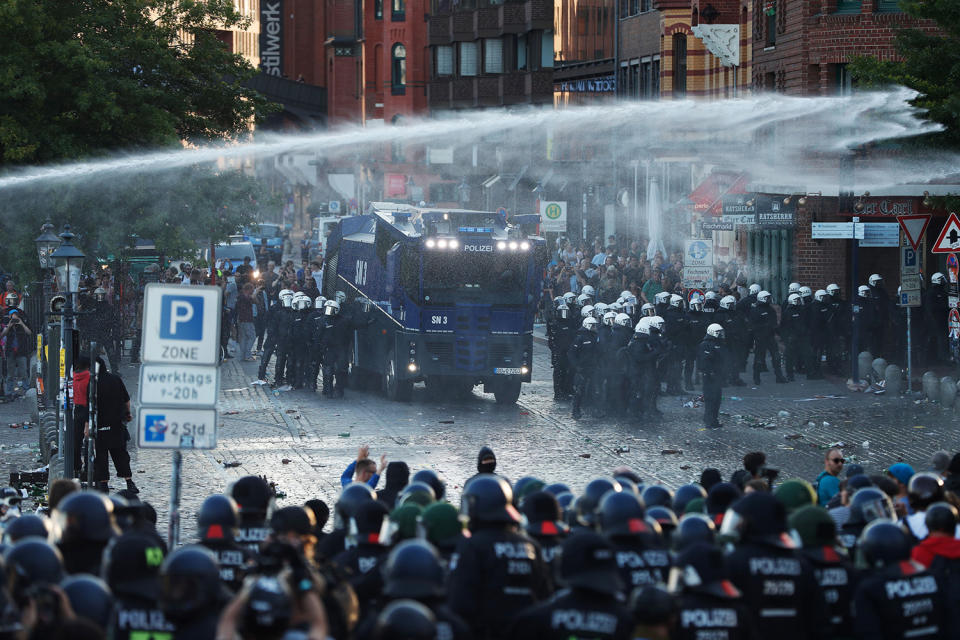 <p>Riot police use water cannon during the “Welcome to Hell” rally against the G-20 summit in Hamburg, northern Germany on July 6, 2017.<br> (Photo: Odd Andersen/AFP/Getty Images) </p>
