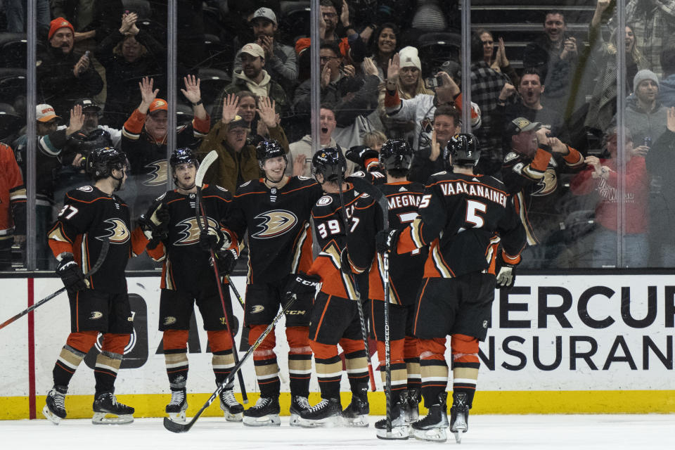 Anaheim Ducks celebrate a 5-4 overtime win over the San Jose Sharks in an NHL hockey game in Anaheim, Calif., Friday, Jan. 6, 2023. (AP Photo/Kyusung Gong)