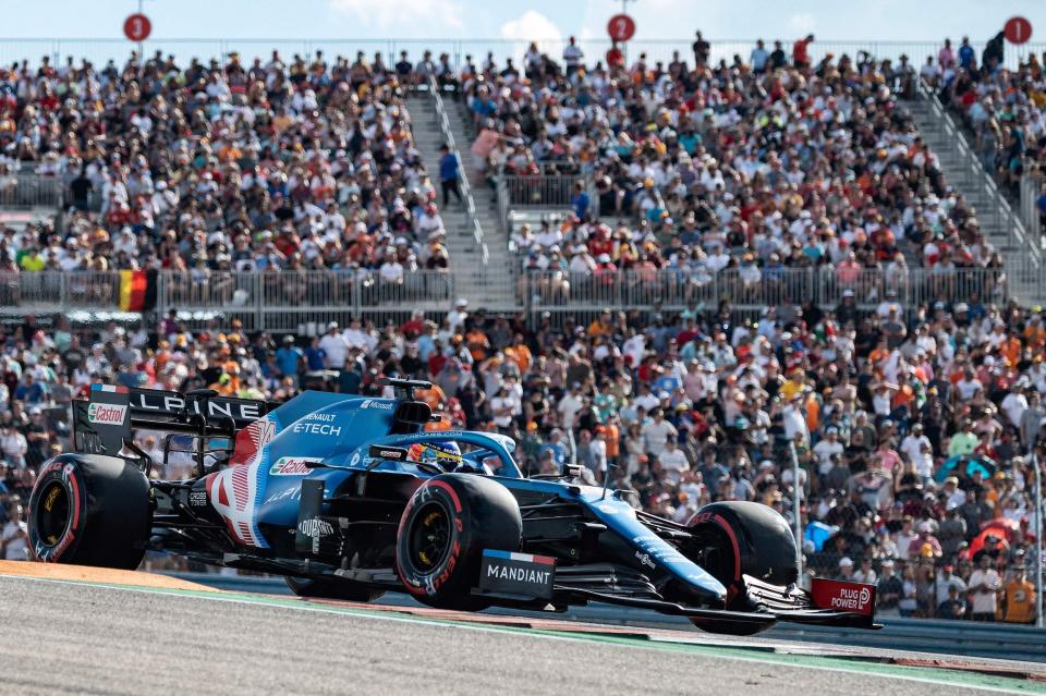 Alpine's Spanish driver Fernando Alonso takes a turn as he races during the qualifying session at the Circuit of The Americas in Austin, Texas