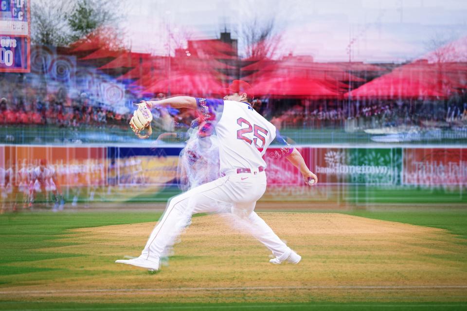 In a multiple exposure image (a photographic technique that combines multiple images into one frame), WooSox Richard Fitts pitches.