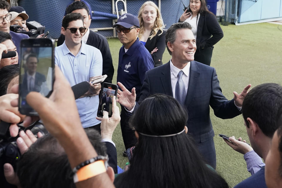 Agent Nez Balelo, middle right, is interviewed after a baseball news conference for Los Angeles Dodgers' Shohei Ohtani at Dodger Stadium Thursday, Dec. 14, 2023, in Los Angeles. (AP Photo/Marcio Jose Sanchez)