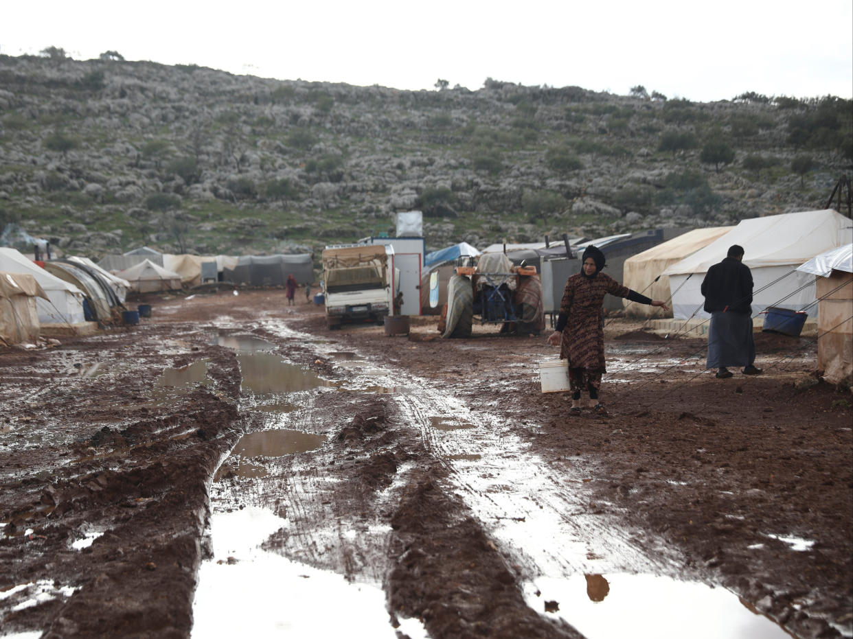 Syrian refugees in a camp near Kafr Aruq, in Idlib province (AP)