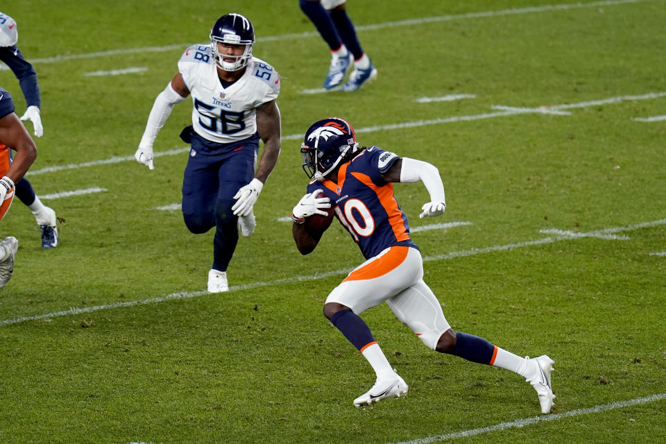 Denver Broncos wide receiver Jerry Jeudy (10) runs the ball as Tennessee Titans linebacker Harold Landry (58) pursues during the first half of an NFL football game, Monday, Sept. 14, 2020, in Denver. (AP Photo/Jack Dempsey)