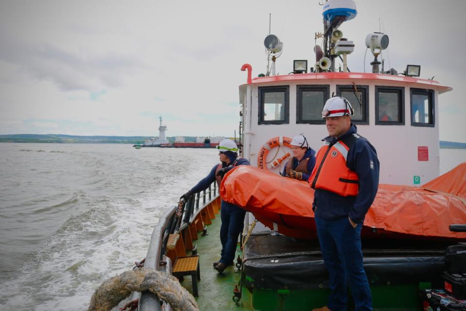 Atlantic Towing port superintendent Alan Roger, foreground, pictured on the deck of the Irving Hazelnut with deckhands Alex Black, right, and Nick MacPhee, left. 