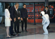 President Barack Obama and ASIMO, an acronym for Advanced Step in Innovative MObility, bow to each other during a youth science event at the National Museum of Emerging Science and Innovation, known as the Miraikan, in Tokyo, Thursday, April 24, 2014. Showing solidarity with Japan, Obama affirmed Thursday that the U.S. would be obligated to defend Tokyo in a confrontation with Beijing over a set of disputed islands, but urged all sides to resolve the long-running dispute peacefully. (AP Photo/Carolyn Kaster)