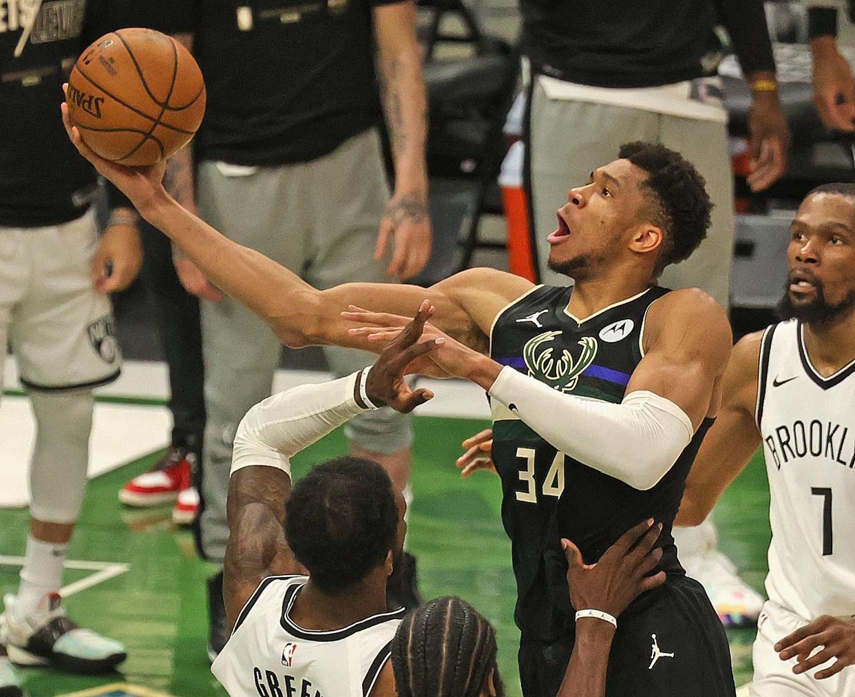 Giannis Antetokounmpo #34 of the Milwaukee Bucks shoots over Jeff Green #8 of the Brooklyn Nets at Fiserv Forum on June 17, 2021 in Milwaukee, Wisconsin. The Bucks defeated the Nets 104-89. NOTE TO USER: User expressly acknowledges and agrees that, by downloading and or using this photograph, User is consenting to the terms and conditions of the Getty Images License Agreement.  (Photo by Jonathan Daniel/Getty Images)