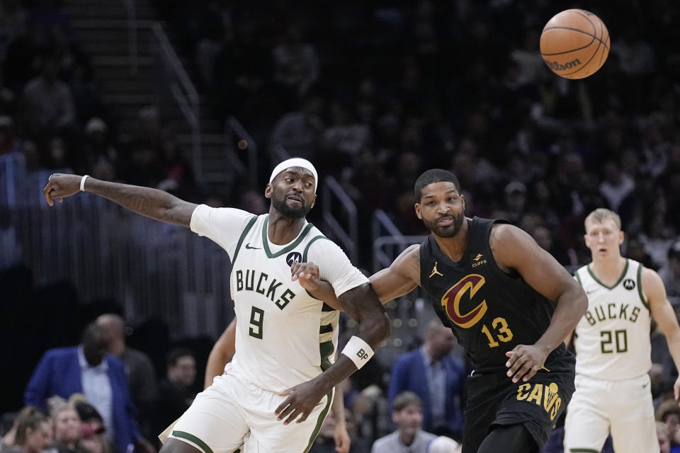 Milwaukee Bucks forward Bobby Portis (9) and Cleveland Cavaliers center Tristan Thompson (13) watch the ball during the second half of an NBA basketball game Wednesday, Jan. 17, 2024, in Cleveland. (AP Photo/Sue Ogrocki)