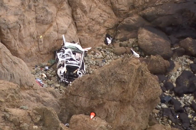 Four people were rescued after a Tesla plunged over a cliff in California on Monday. (NBC Bay Area)