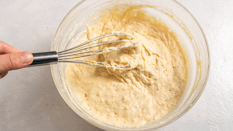 Whisking pancake batter in a bowl