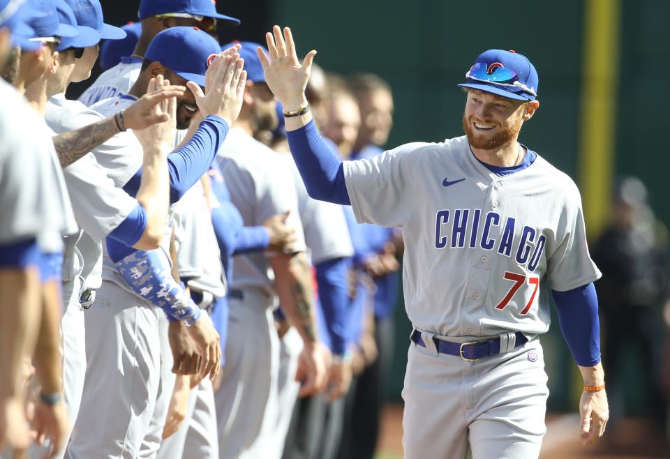 Frazier greets his Cubs teammates on opening day.