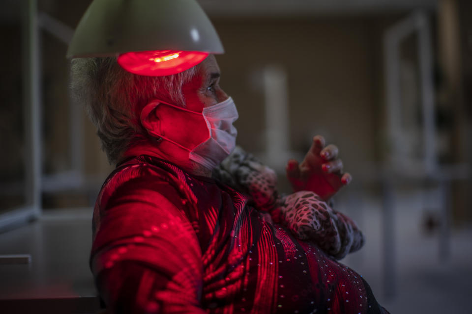 A resident rests at DomusVi nursing home in Leganes, Spain, Wednesday, March 10, 2021. (AP Photo/Manu Fernandez)