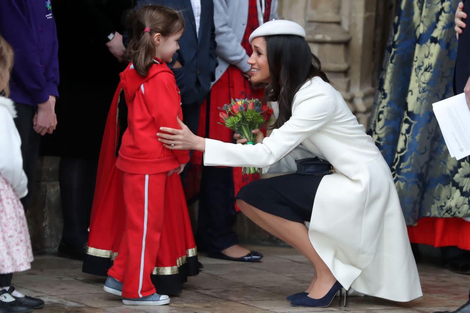 Meghan was pictured accepting a bouquet of flowers from a girl outside the church. Photo: Getty Images